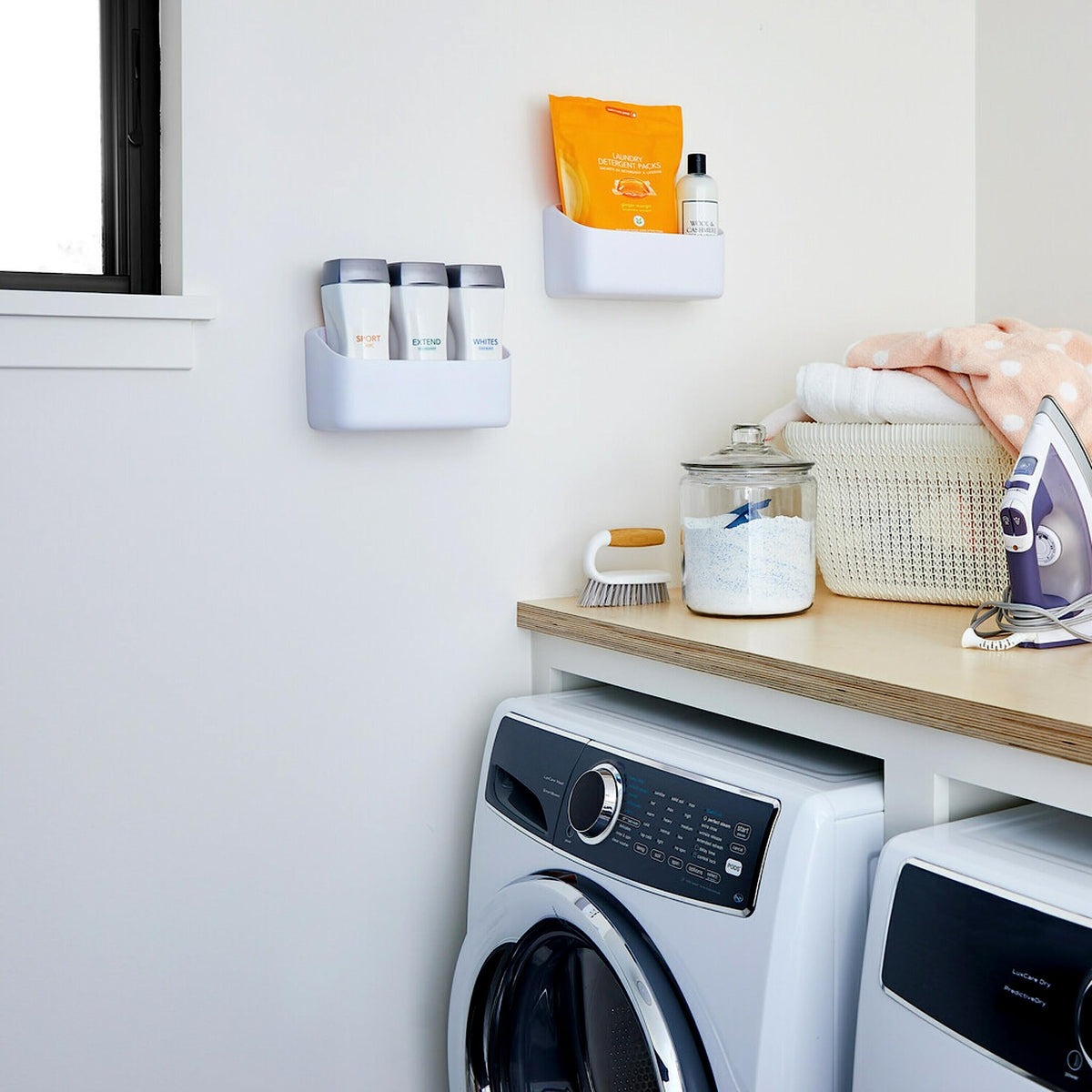 Command Organizing Caddy for pantry storage keeps bottles and boxes orderly.