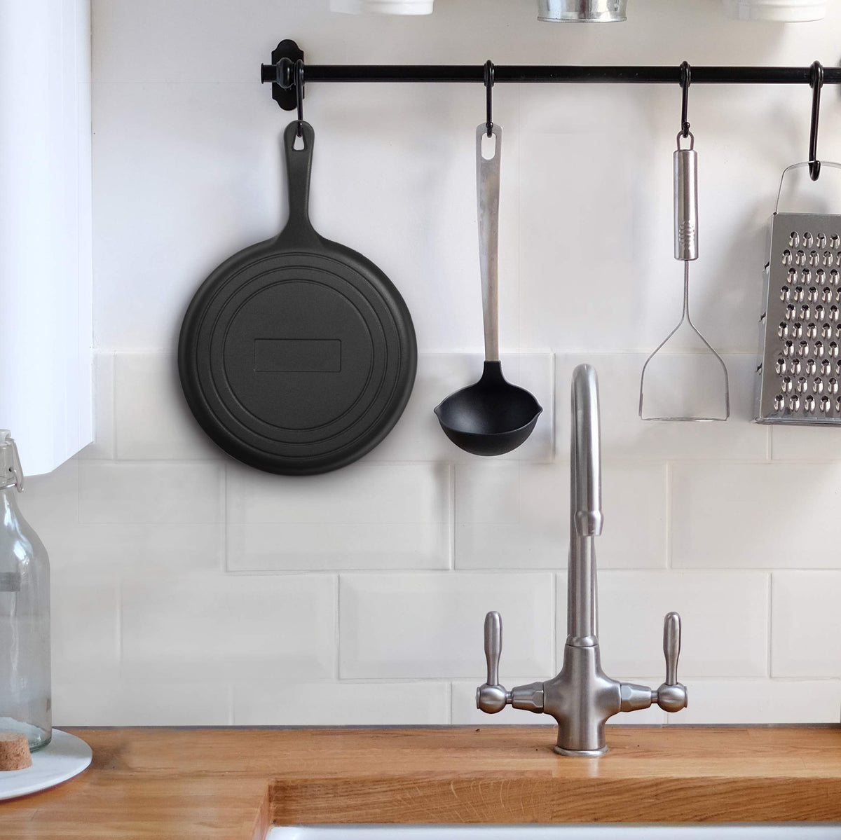Commercial CHEF griddle featuring a built-in hanging hole in the handle for easy storage.