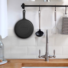 Commercial CHEF griddle featuring a built-in hanging hole in the handle for easy storage.