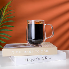 COMOME double-walled mug with rolled edge and ergonomic handle for easy gripping.