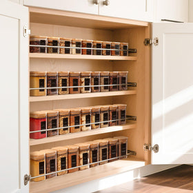 Modern design ComSaf spice containers add contemporary style to kitchen shelves.