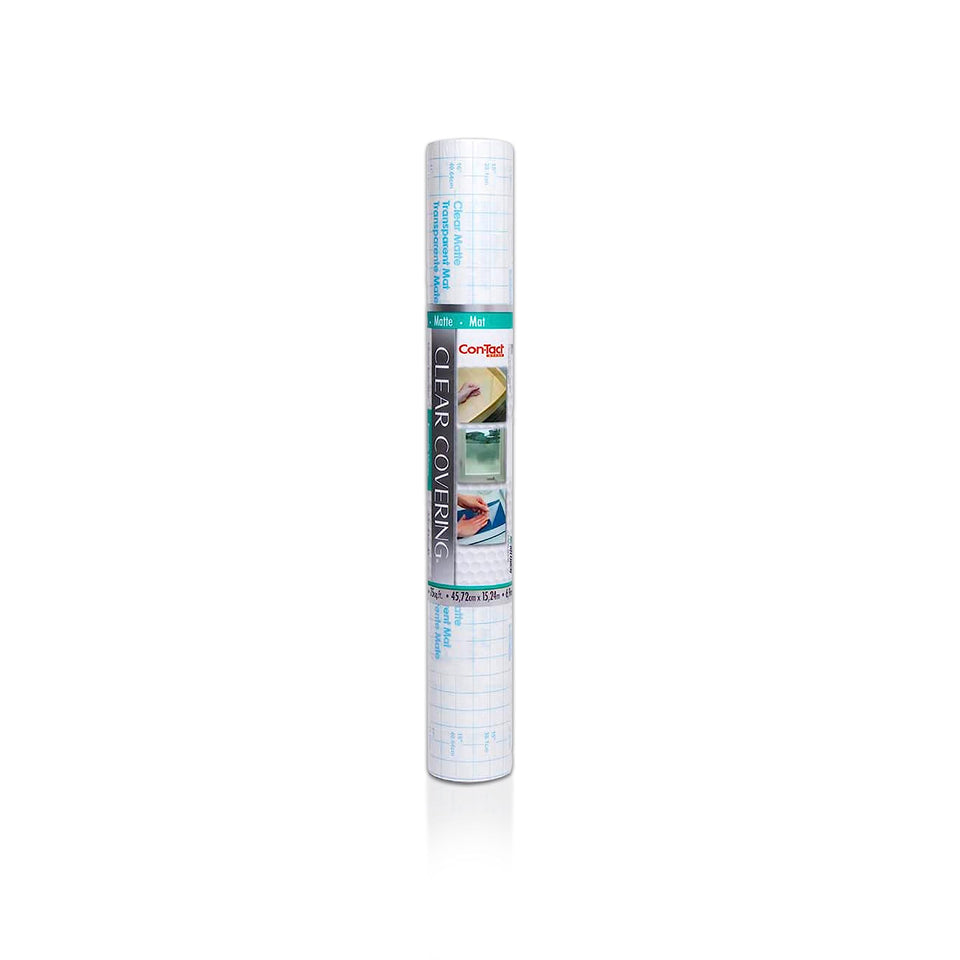 Con-Tact Creative Clear Covering on a shelf showing wood grain and protection from dust