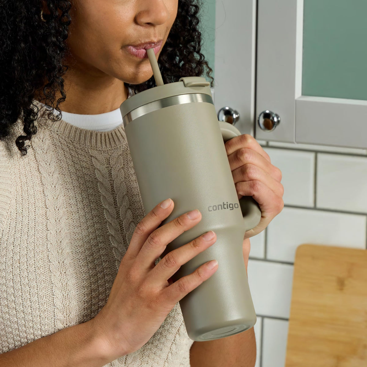 Contigo Streeterville 40oz tumbler fits most cupholders for car trips.