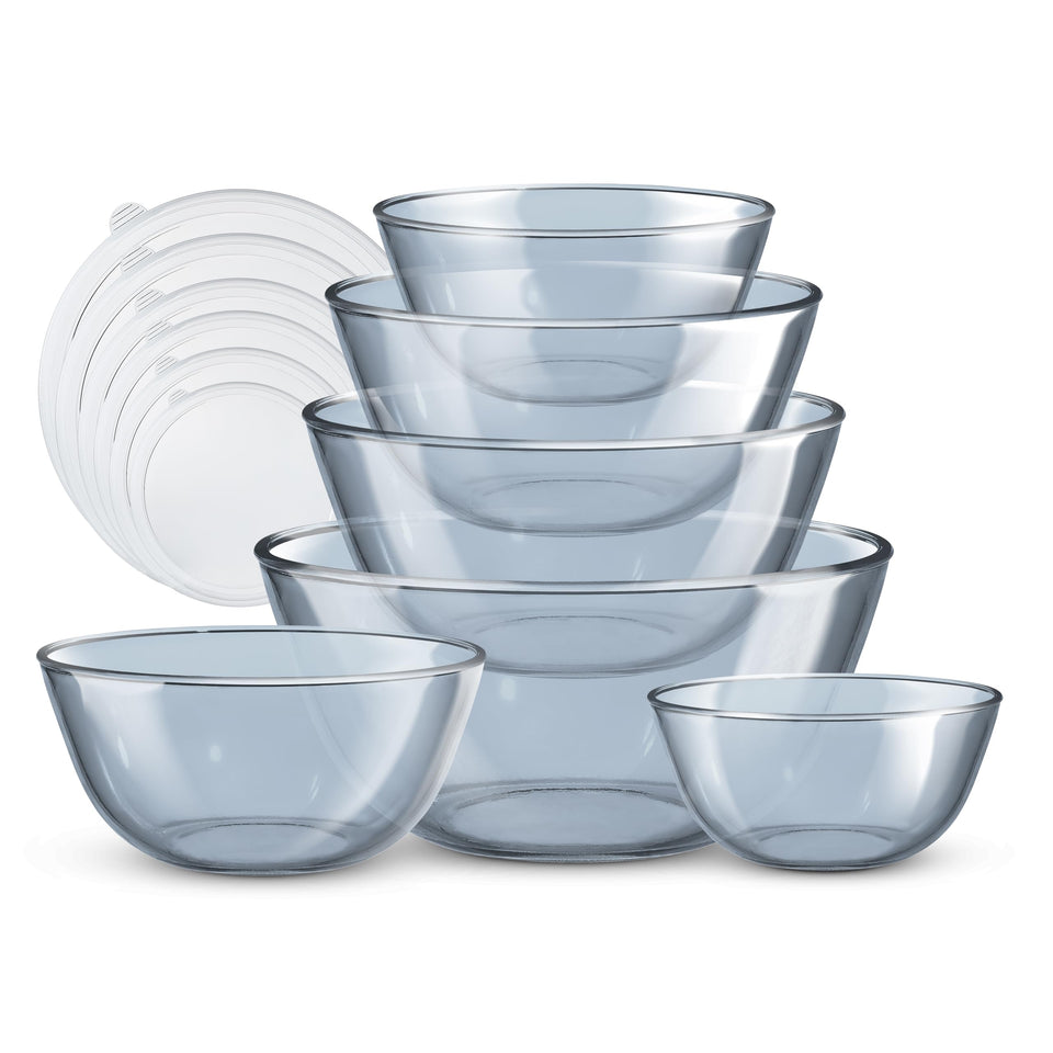 COOK WITH COLOR 12-piece borosilicate glass bowls with blue lids, nesting for space-saving storage.