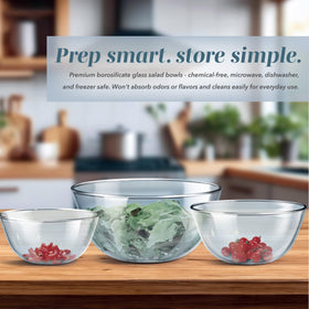 COOK WITH COLOR blue-lidded bowls shown stacked, highlighting space-saving organization.