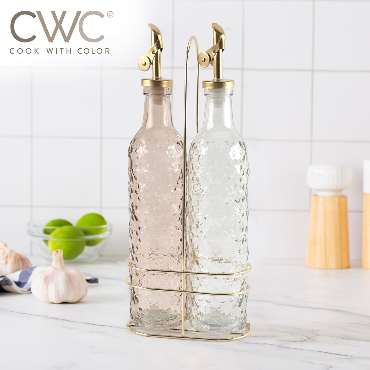 COOK WITH COLOR elegant olive oil bottle complements floral brown kitchen decor.