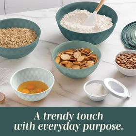 COOK WITH COLOR bowls on a dishwasher-safe rack.