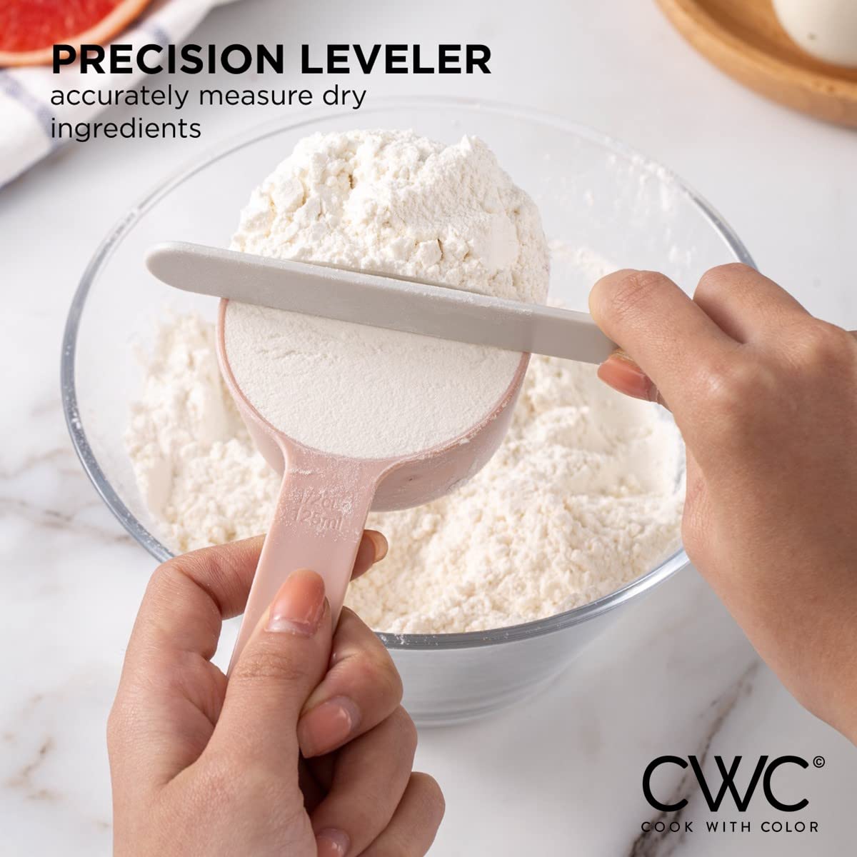 COOK WITH COLOR pastel scraper helps level dry ingredients