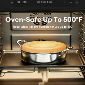 Cooker King pan on induction stove with oven-safe design for versatile cooking.