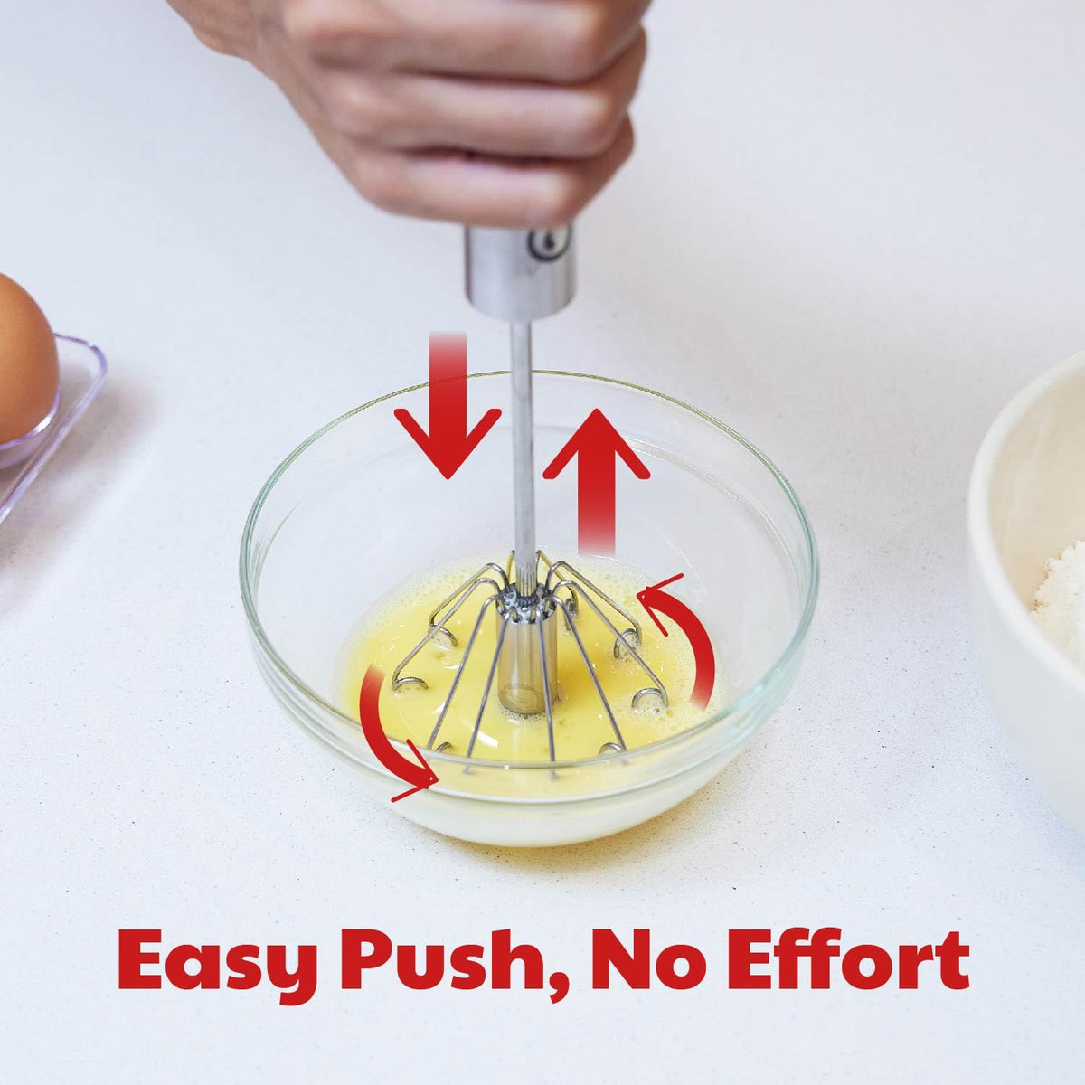 Cooks Innovations semi-automatic whisk demonstrates rotation mechanism for effortless mixing.