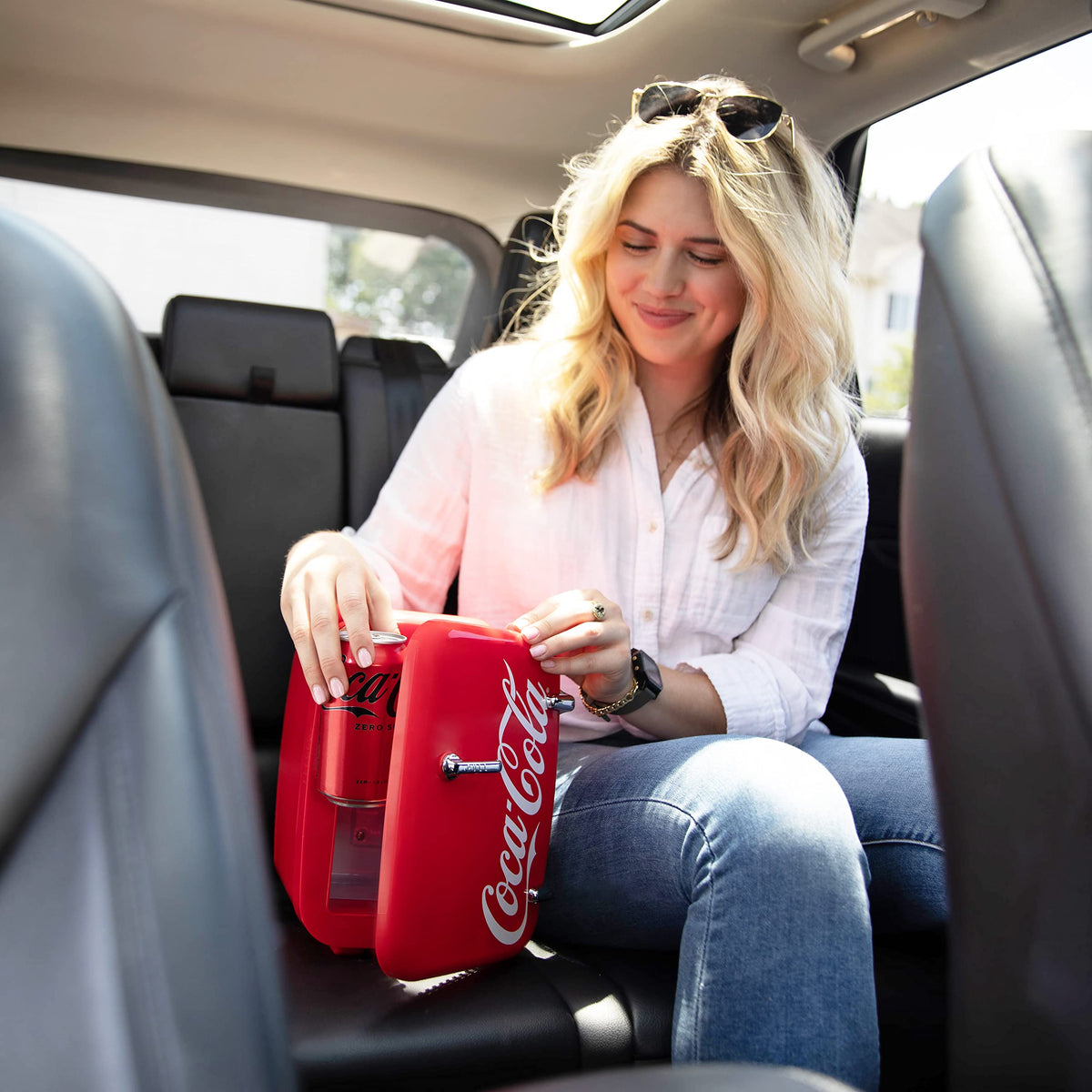 Cooluli Retro Coca-Cola Mini Fridge in a bedroom setup keeps beverages and cosmetics within reach.