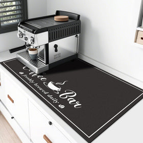 CooRug absorbent coffee mat shown on a counter, 17x32 inches, absorbs spills and stays in place