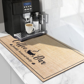CooRug absorbent coffee mat in beige absorbs spills while protecting countertops.