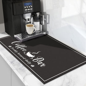 CooRug absorbent coffee mat in black close-up showing plush surface and non-slip texture for counter protection