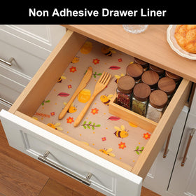 Cooyes liner in a bathroom cabinet enhances neat storage with pattern.