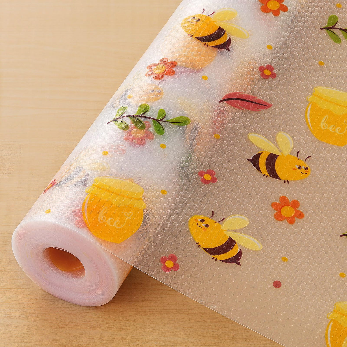Cooyes shelf liner with a daisy pattern protecting a drawer from spills.