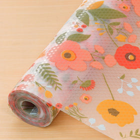 Cooyes shelf liner with a daisy pattern, top view, protects cabinets and adds style.