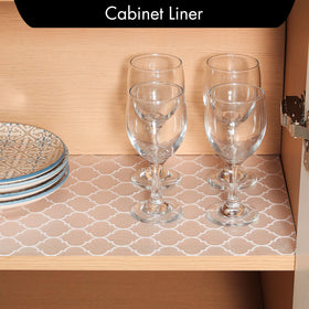 Cooyes shelf liner being cut to fit a drawer for neat organization.