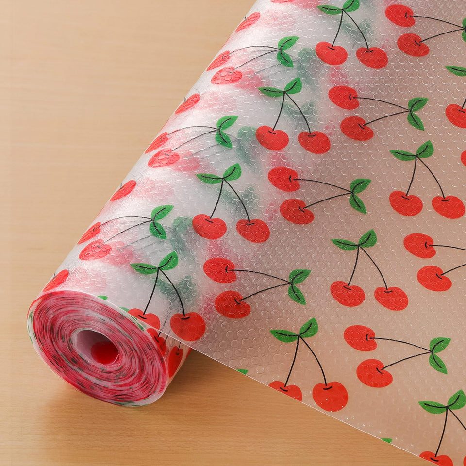 Cooyes shelf liner with red cherry pattern protects shelves from spills.