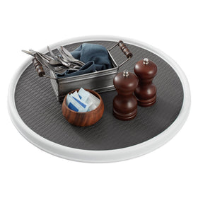 Copco lazy susan inside cabinet keeps bottles organized and within reach.
