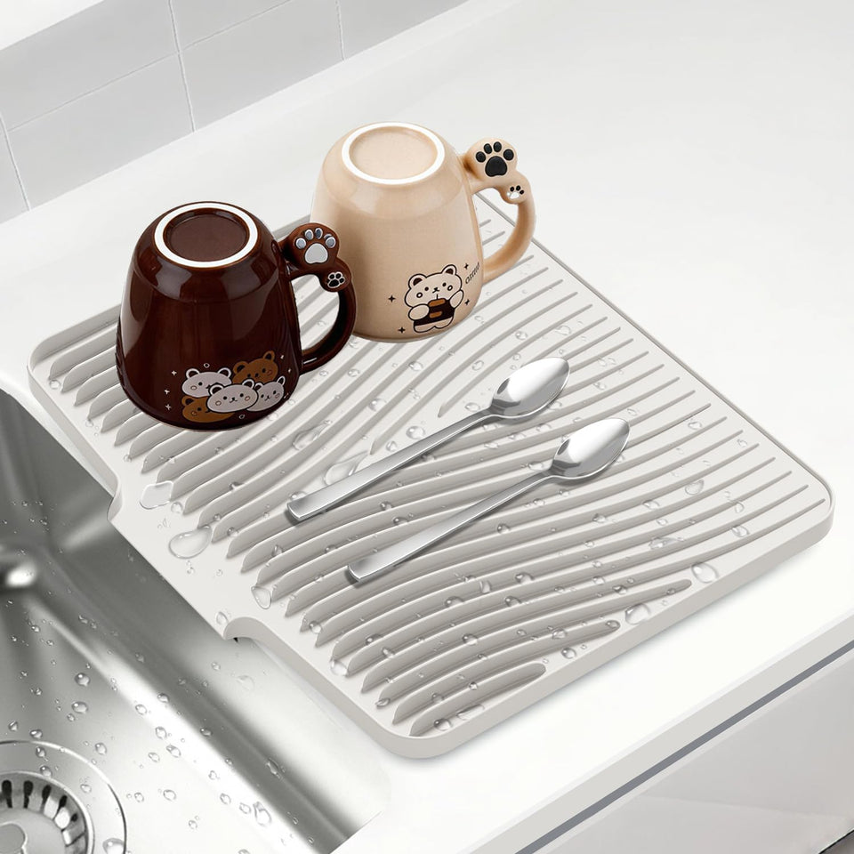 COPLIB silicone dish drying mat on kitchen counter with built-in drain rim.