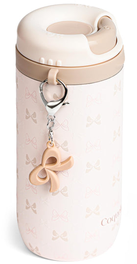 Coquella bow-cream tumbler with twist-open lid for easy iced-coffee sipping.