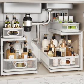 Corbyles under-sink organizer with ball-bearing slides keeps heavy bottles easy to reach.