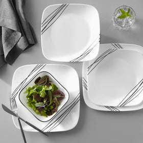 Corelle Vitrelle salad plates neatly stacked, emphasizing compact storage.