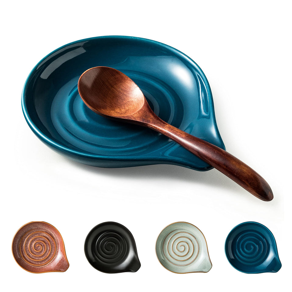 Cormomu spoon holder with blue swirl on stove keeps utensils organized.