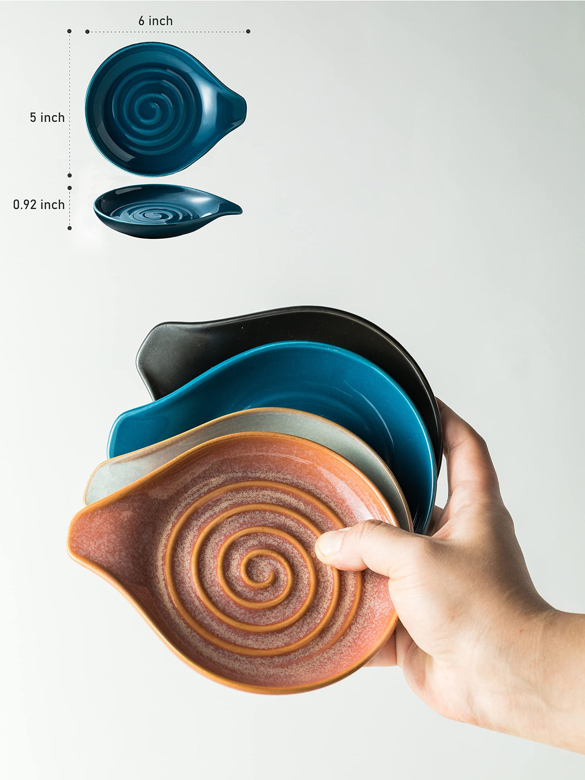 Cormomu blue swirl spoon holder on countertop for easy access to utensils.