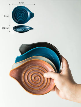 Cormomu blue swirl spoon holder on countertop for easy access to utensils.