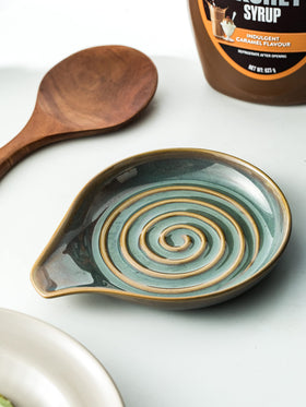 Cormomu utensil rest on countertop ready for spoons, tongs, and spatulas during meal prep.