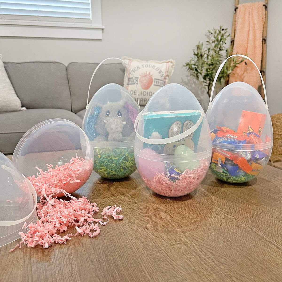 Cornucopia Brands giant clear egg-shaped buckets with handles for easy handling and reuse.