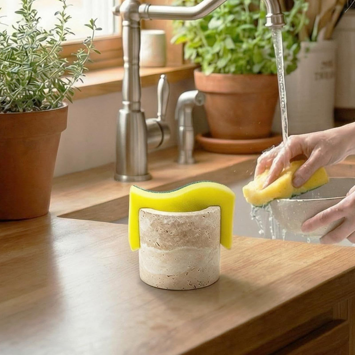 Cotivaye travertine sponge holder top view emphasizes porous stone that dries sponges naturally.