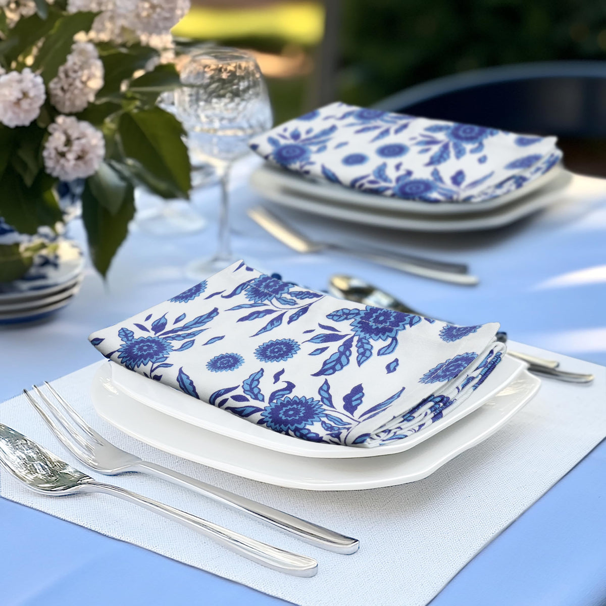 Cotton Craft two-tone white-on-blue napkins ideal for formal dinners.