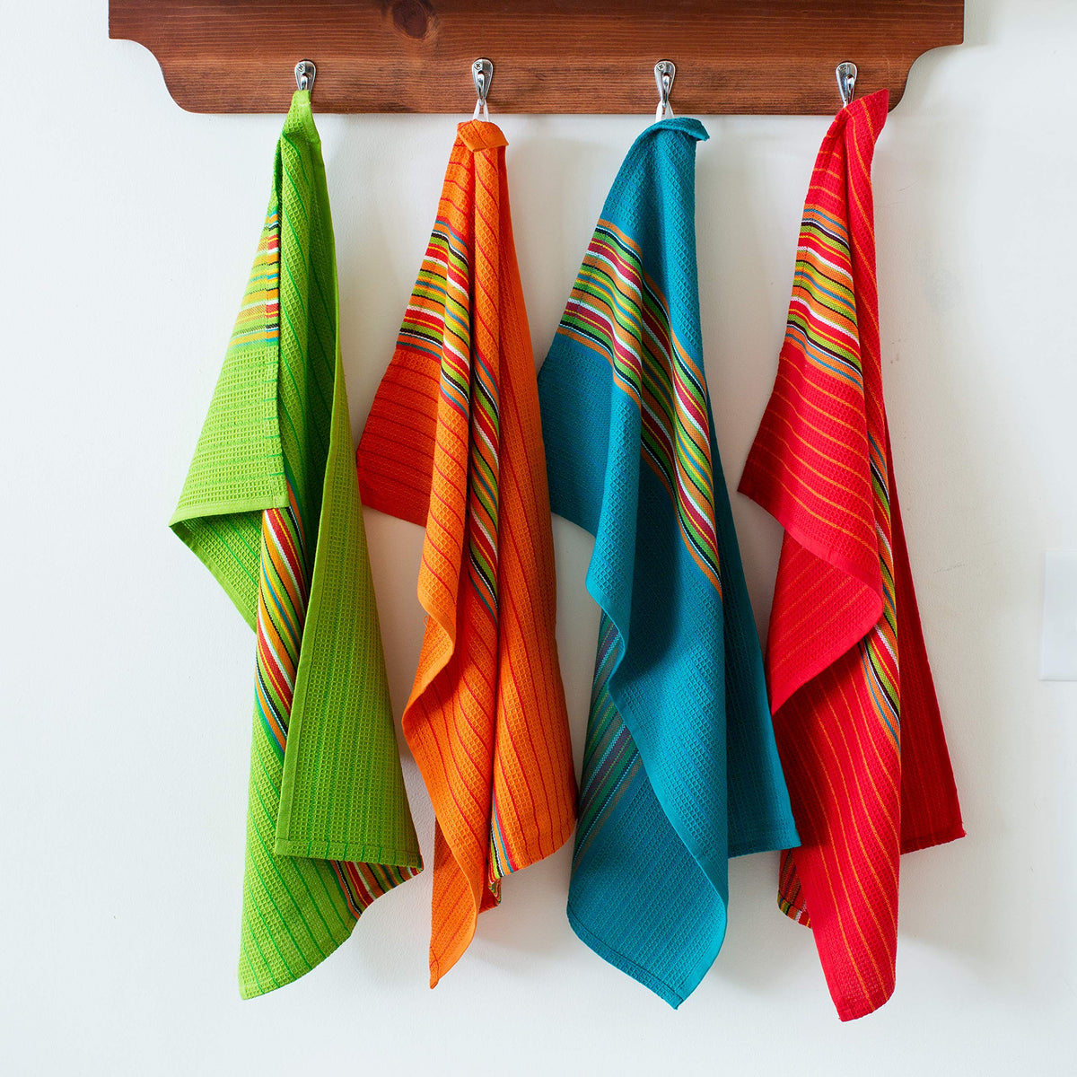 Cotton Craft folded kitchen towels show soft fabric and durable weave.