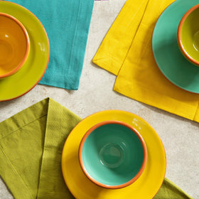 Cotton Craft holiday table setup with napkins in bold colors