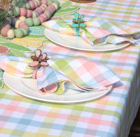 Pastel color palette with white and pink accents complements seasonal centerpieces.