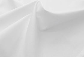 COTTON CRAFT twill weave closeup shows durable, soft texture for upscale table settings.