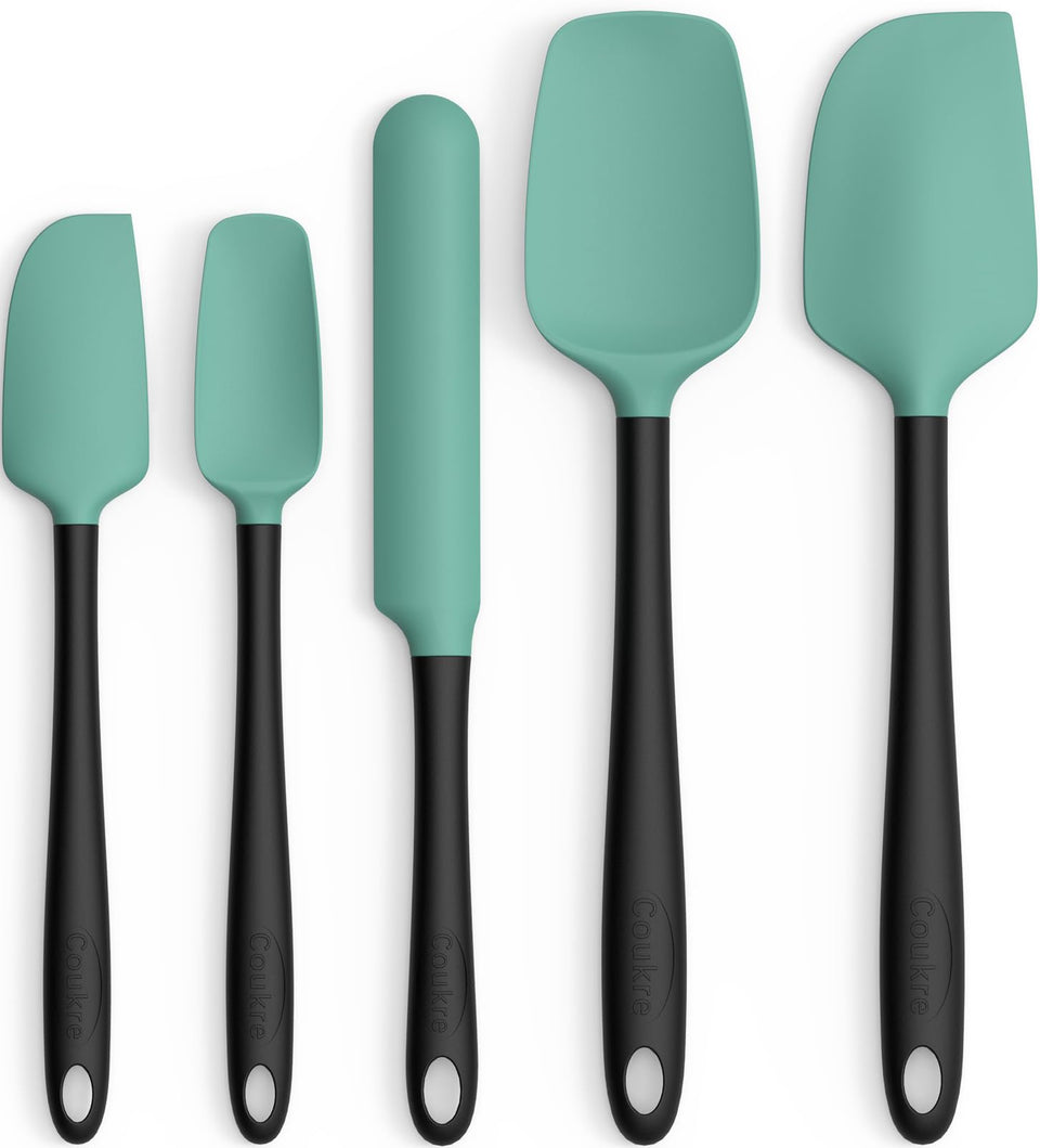 Coukre large spatula from the aqua green set for easy flipping and scraping.