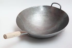 Craft Wok 16-inch steel helper handle closeup highlights cool-touch design.