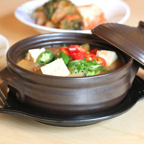 Crazy Korean Cooking Stoneware bowl on stovetop promotes versatile cooking and serving.