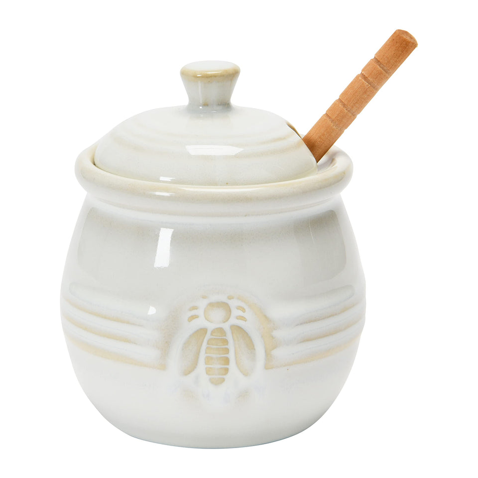 Creative Co-Op farmhouse embossed stoneware honey pot with bee motif for stylish honey storage.