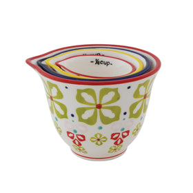 Creative Co-Op 3/4 cup floral design measures ingredients while adorning kitchen shelves.