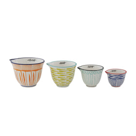 Creative Co-Op hand-stamped striped stoneware measuring cup with curved pour spout for easy liquids.