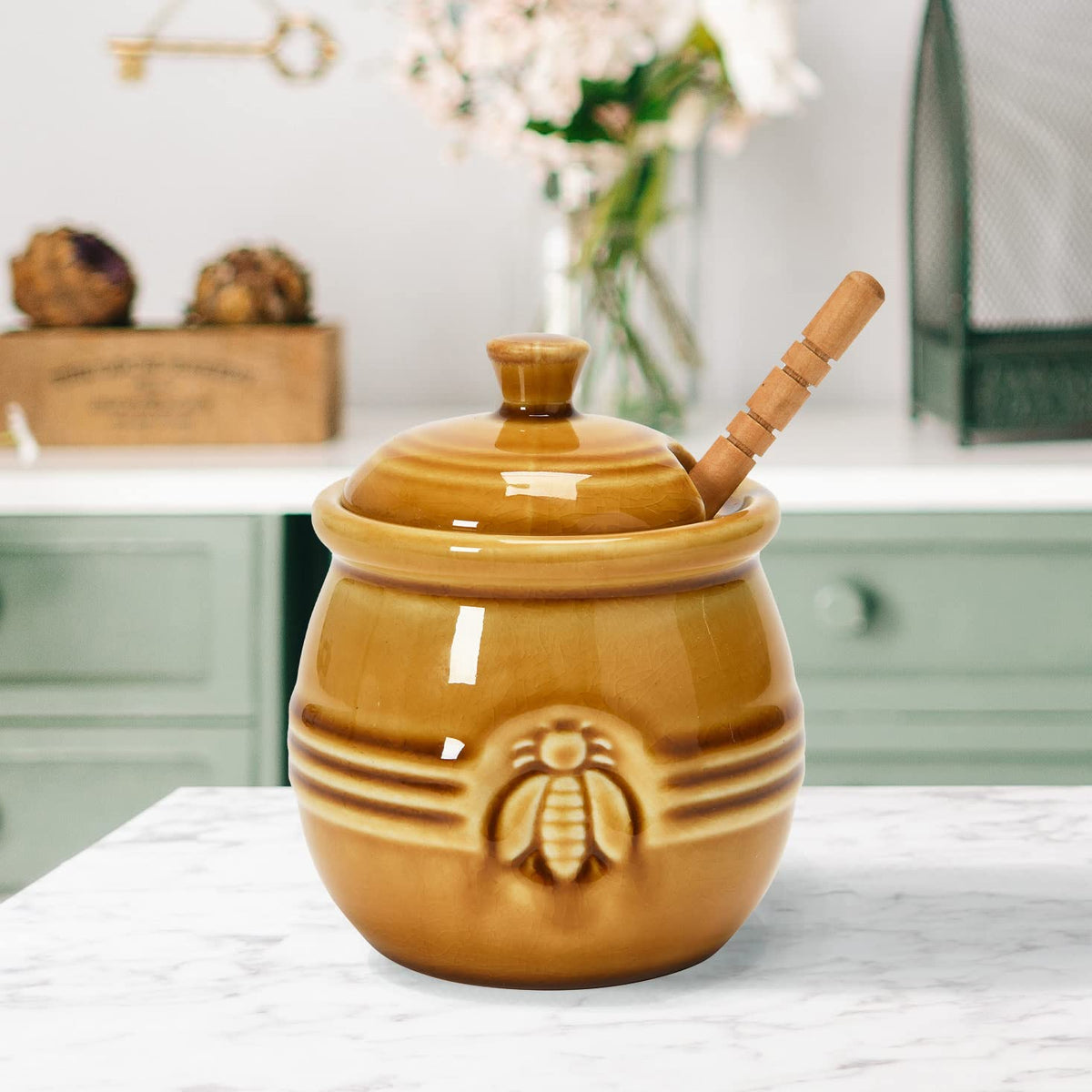 Creative Co-Op wooden honey dipper pairs with pot for effortless honey drizzle