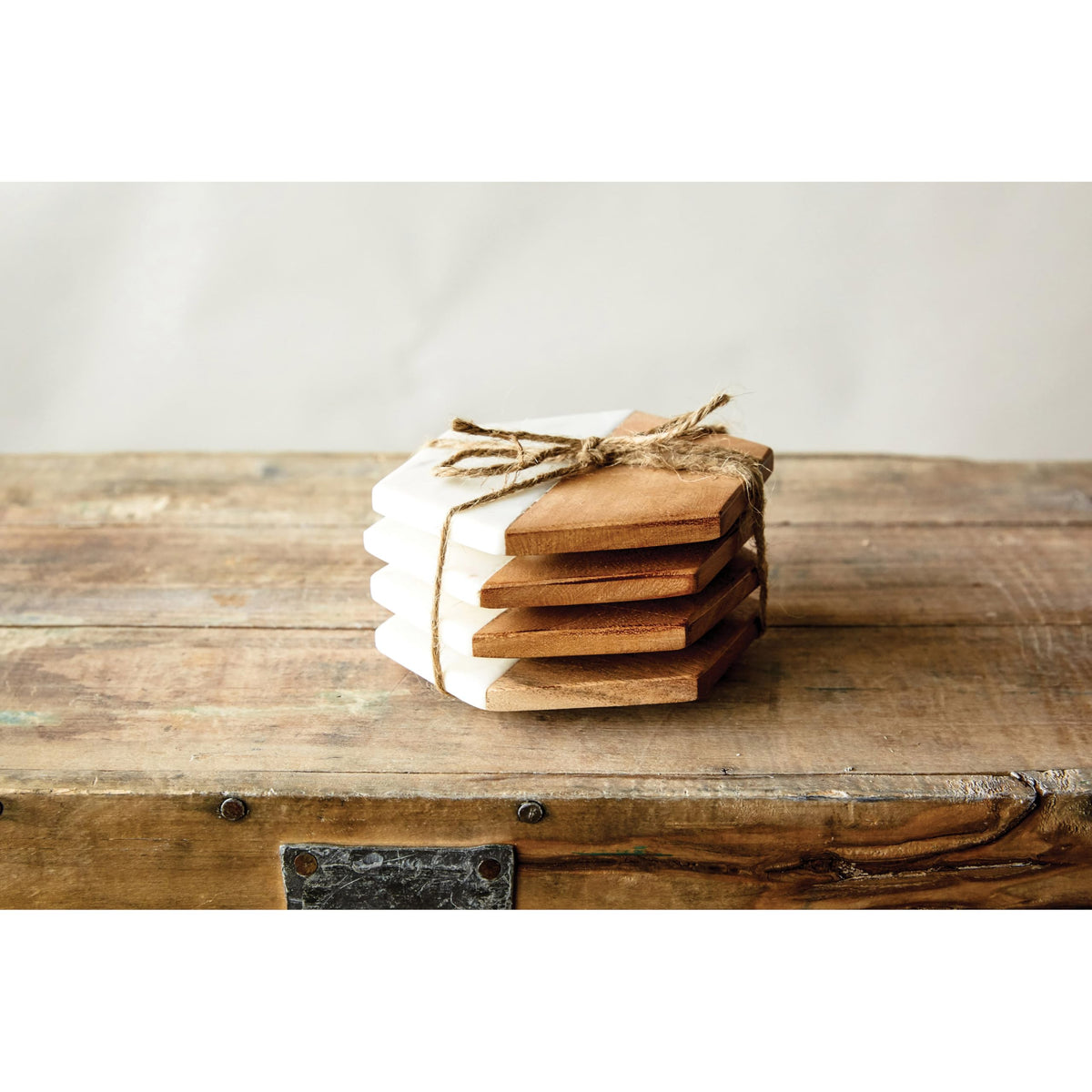 Creative Co-Op hexagon coaster set preserves table surfaces after beverages.