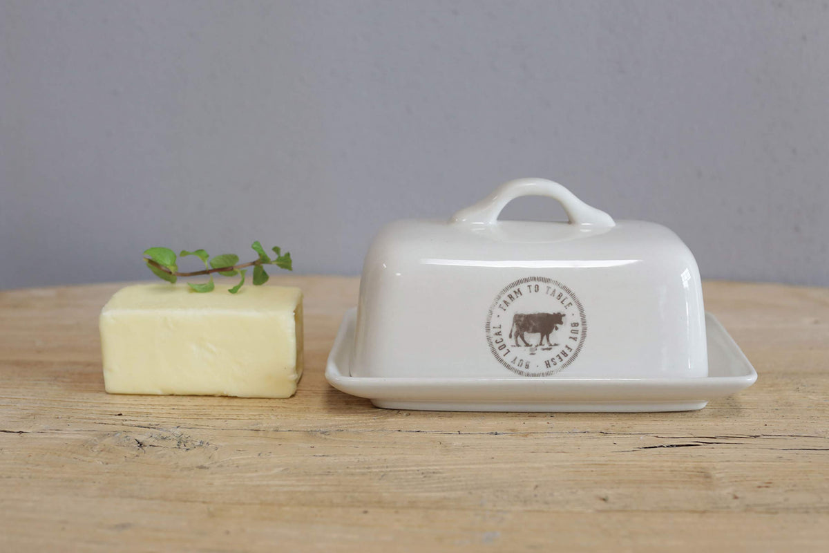 Creative Co-Op cow-decal butter dish complements cottage kitchen aesthetics