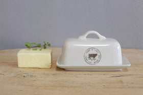 Creative Co-Op cow-decal butter dish complements cottage kitchen aesthetics