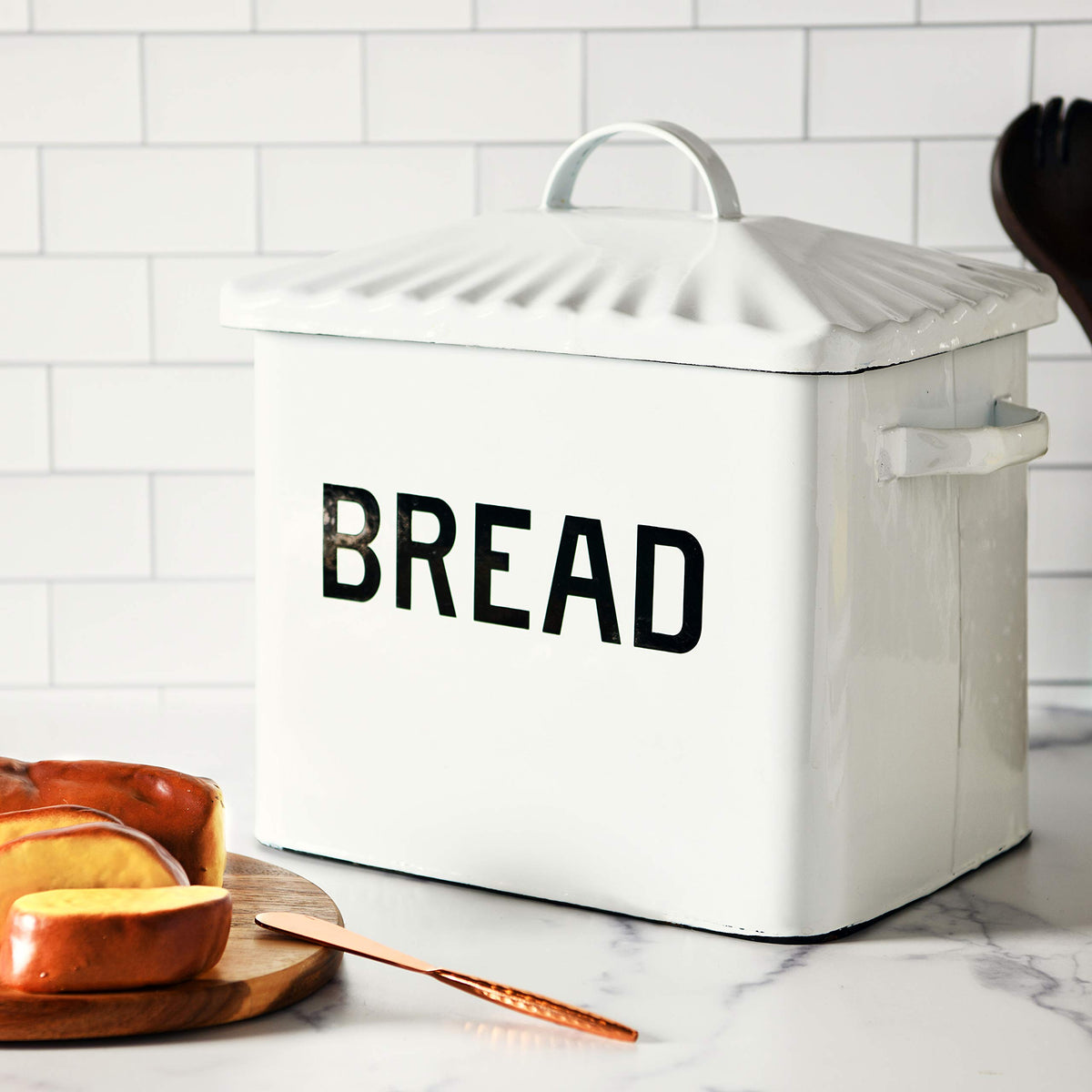 Creative Co-Op two-tone enameled bread box adds rustic style.